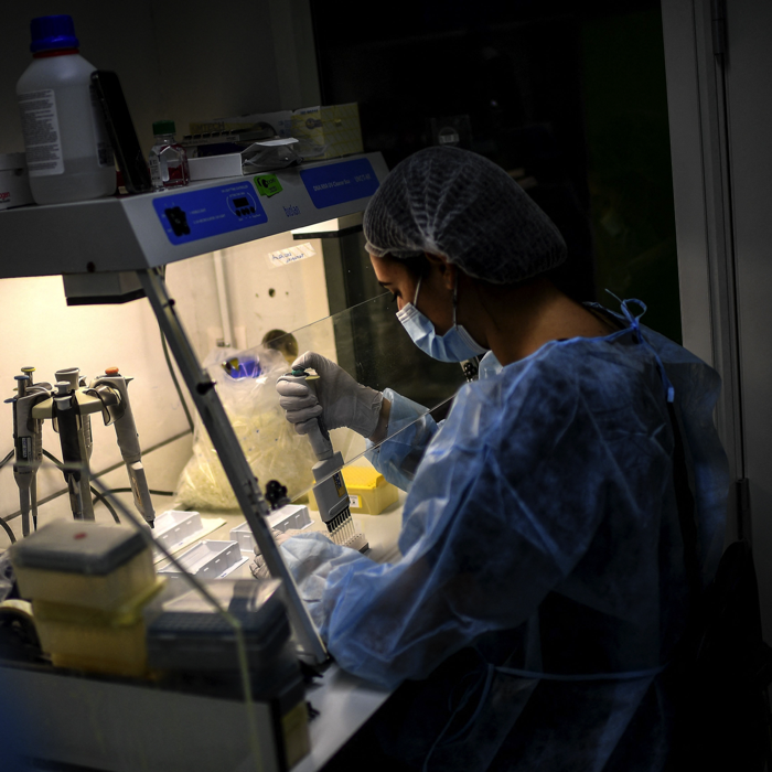 A lab technician works on genome sequencing of the SARS-CoV-2 virus in Paris in January.